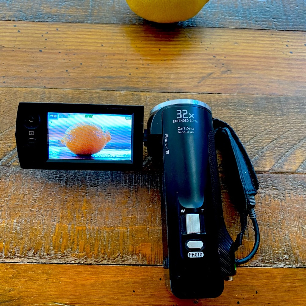 Sony Handycam HD-CRX230 w/ Carl Zeiss wide-angle lens and charge chord.